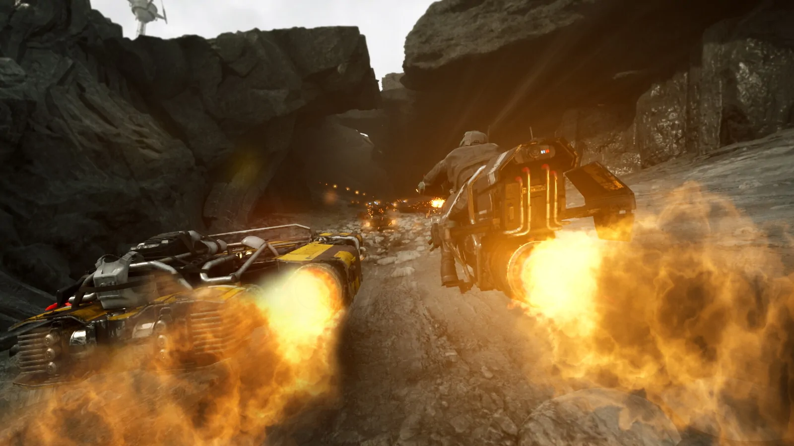 A yellow speeder kicking up dust as it boosts through a sunlit canyon track